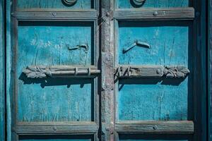 Latch with padlock on door in India photo