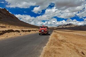 Manali Leh road in Indian Himalayas with lorry. Ladakh, India photo