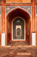 Arch with carved marble window. Humayun's tomb, Delhi photo