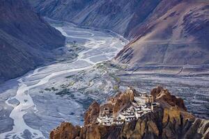 Dhankar monastry perched on a cliff in Himalayas, India photo