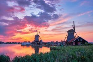 Windmills at Zaanse Schans in Holland on sunset. Zaandam, Nether photo