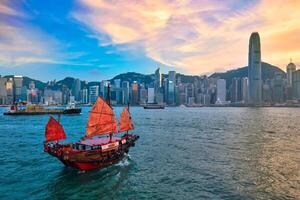 Junk boat in Hong Kong Victoria Harbour photo