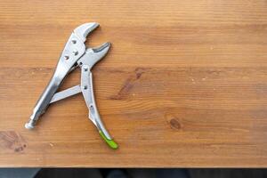 hand vise , clamp on wooden table photo