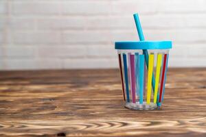 Cup With Straw on Table photo