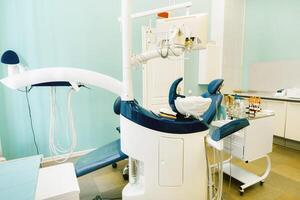 An empty chair in the dentist's office. Empty dentist's office photo