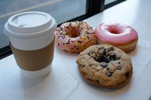 ai generado allí es un cartulina café taza y Tres rosquillas en el mesa foto