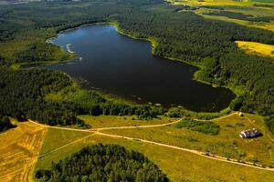 Top view of the lake Bolta in the forest in the Braslav lakes National Park, the most beautiful places in Belarus.An island in the lake.Belarus. photo