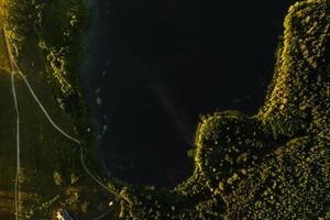 Top view of the lake Bolta in the forest in the Braslav lakes National Park, the most beautiful places in Belarus.An island in the lake.Belarus. photo