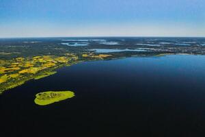 Top view of lake Drivyaty in the Braslav lakes National Park, the most beautiful lakes in Belarus.An island in the lake.Belarus. photo