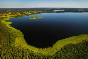 Top view of lake Drivyaty in the Braslav lakes National Park, the most beautiful lakes in Belarus.An island in the lake.Belarus. photo