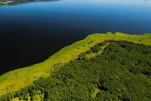 Top view of lake Drivyaty in the Braslav lakes National Park, the most beautiful lakes in Belarus.An island in the lake.Belarus. photo