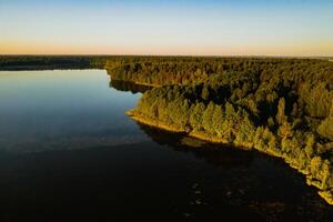 Top view of the lake Bolta in the forest in the Braslav lakes National Park, the most beautiful places in Belarus.An island in the lake.Belarus. photo