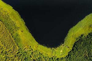 Top view of lake Drivyaty in the Braslav lakes National Park, the most beautiful lakes in Belarus.An island in the lake.Belarus. photo