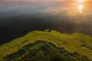 Top view of lake Drivyaty in the forest in the Braslav lakes National Park at sunset, the most beautiful places in the city of Belarus.An island in the lake.Belarus. photo