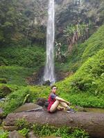 Malang, Indonesia, 22 October 2023 - View of people and Watu Ondo waterfall, Malang photo