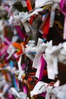 A fortune telling slip at Tomioka Shrine closeup photo