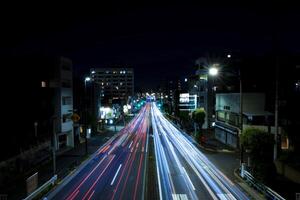 A night traffic jam at the urban street in Tokyo wide shot photo