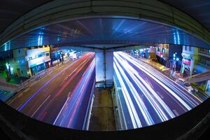 A night traffic jam under the highway in Tokyo fish eye shot photo