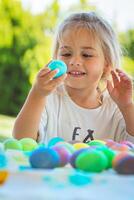 Happy Baby Coloring Easter Eggs photo