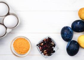 The process of dyeing Easter eggs with natural dyes at home. Close-up. Top view. Copy space. photo