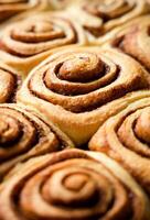 Delicious homemade freshly baked cinnamon buns. Traditional American dessert. Close-up.Vertical photo. Selective focus. photo