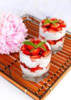 Healthy food concept. Healthy breakfast of fresh strawberry, yogurt and chia seeds on a wicker tray. photo