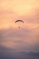 Paragliding in the sky of Sao Vicente, Brazil. photo