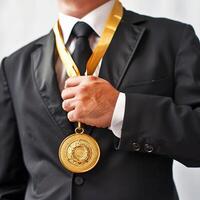 AI generated businessman holding a gold medal in black suit. photo