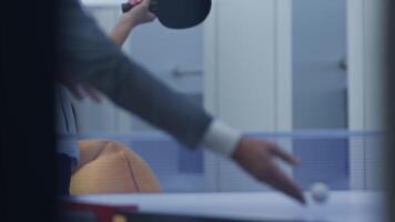 People in office clothes playing table tennis. video