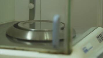 Weighing on a precision balance in a chemical laboratory. video