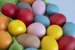 eggs painted in different colors to celebrate Easte photo