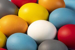 eggs painted in different colors to symbolize the passage of Christian Easter photo