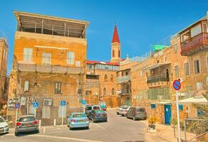 Acre, Israel - 10 May, 2023. Typical courtyard with historical residential houses in the ancient city of Acre photo