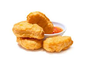 Front view of chicken nugget with chili sauce isolated on white background with clipping path photo