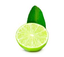 Front view of fresh green lemon half with leaf isolated on white background with clipping path photo