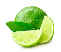 Front view of fresh green lemon fruit with slices or quarters and leaf isolated on white background with clipping path photo