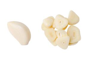 Top view set of peeled white garlic cloves with slices in stack isolated on white background with clipping path photo