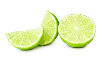 Front view of fresh green lemon half with slices or quarters isolated on white background with clipping path photo