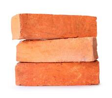 Side view of old cracked red or orange bricks in stack isolated on white background with clipping path photo