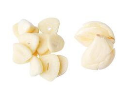 Top view set of pounded garlic cloves and slices in stack isolated on white background with clipping path photo