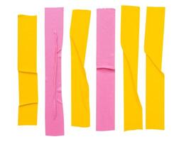 Top view set of pink and yellow wrinkled adhesive vinyl tape or cloth tape in stripes shape isolated on white background with clipping path photo