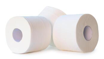 Front view of white tissue paper or toilet paper rolls in stack isolated on white background with clipping path photo