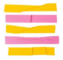 Top view set of pink and yellow wrinkled adhesive vinyl tape or cloth tape in stripes shape isolated on white background with clipping path photo