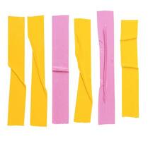 Top view set of wrinkled yellow and pink adhesive vinyl tape or cloth tapes in stripe shape isolated on white background with clipping path photo