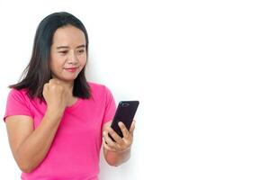 Asian woman in t-shirt with smartphone over white background. photo