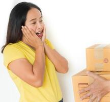 Woman receiving parcel from delivery man. photo