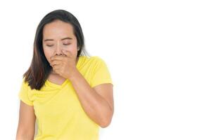 The woman wears a yellow shirt with a cough hand to mouth.Isolated on white. photo