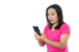 Asian woman in t-shirt with smartphone over white background. photo