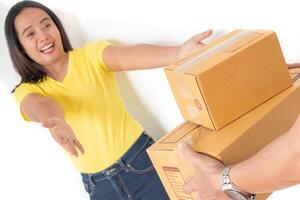 Women are happy to receive big box parcels. photo