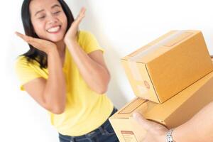 Woman receiving parcel from delivery man. photo